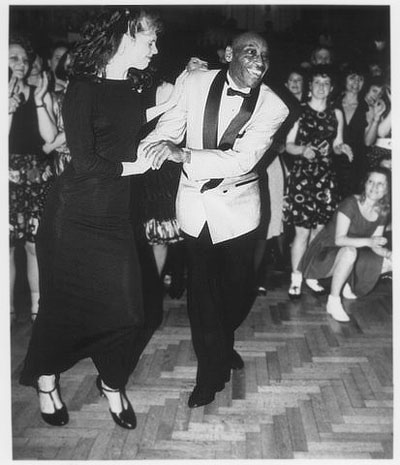Frankie Manning dancing with Cynthia Millman at CAN'T TOP THE LINDY HOP! during a birthday dance on the occasion of his 80th birthday party in New York City, 1994. Photographer: Timothy Swiecicki.